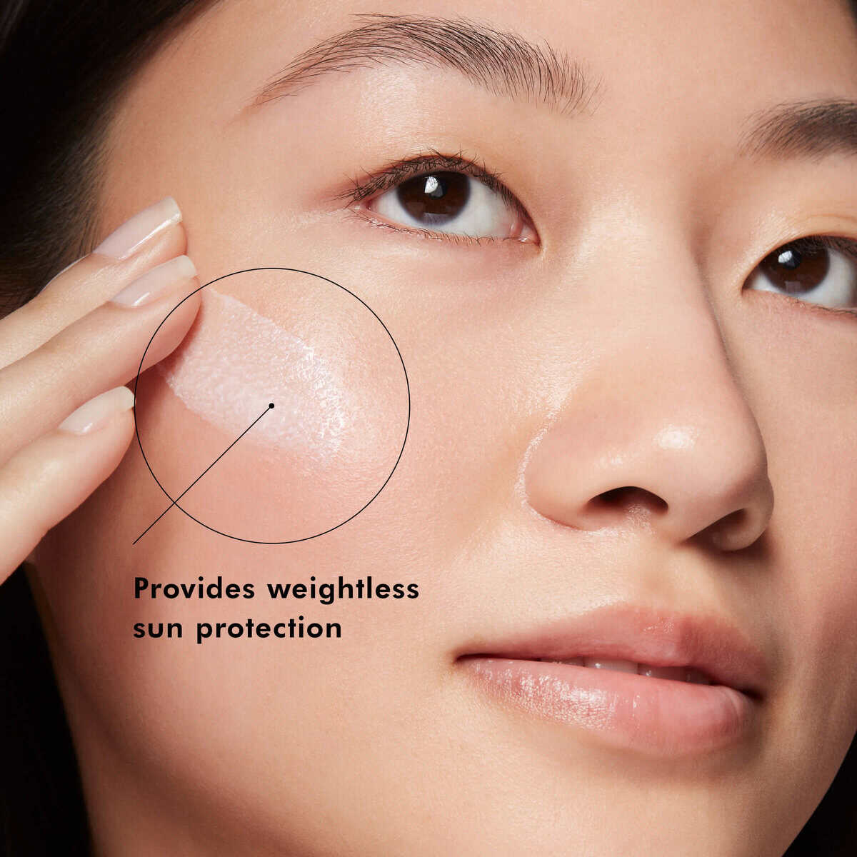Woman applying skincare with sun protection for healthy, radiant skin.