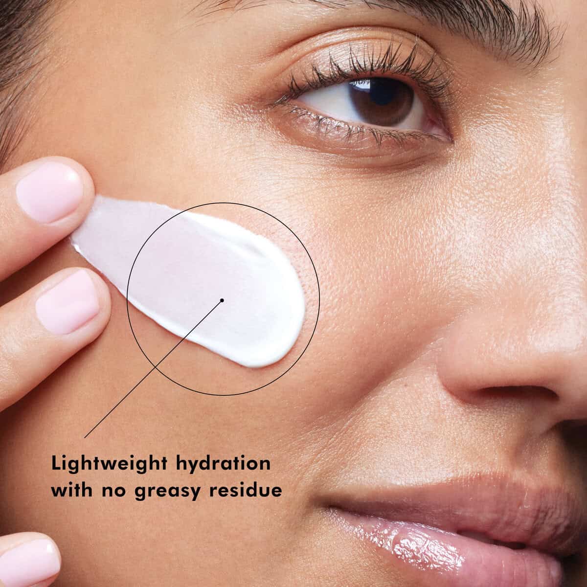 Woman applying lightweight, hydrating skincare with no greasy residue on her face.