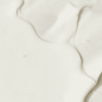 Elegant white marble surface with subtle veining, ideal for wellness and spa settings.