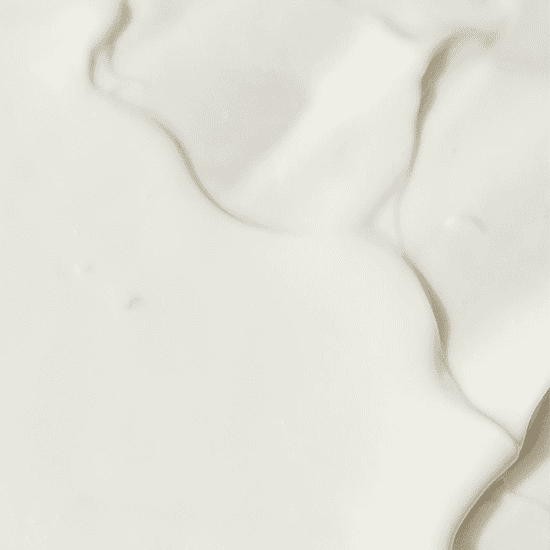 Elegant white marble surface with subtle veining, ideal for wellness and spa settings.